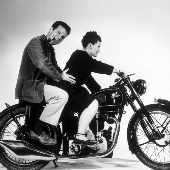 Charles and Ray Eames posing on an Velocette motorcycle, 1946 © Eames Office LLC